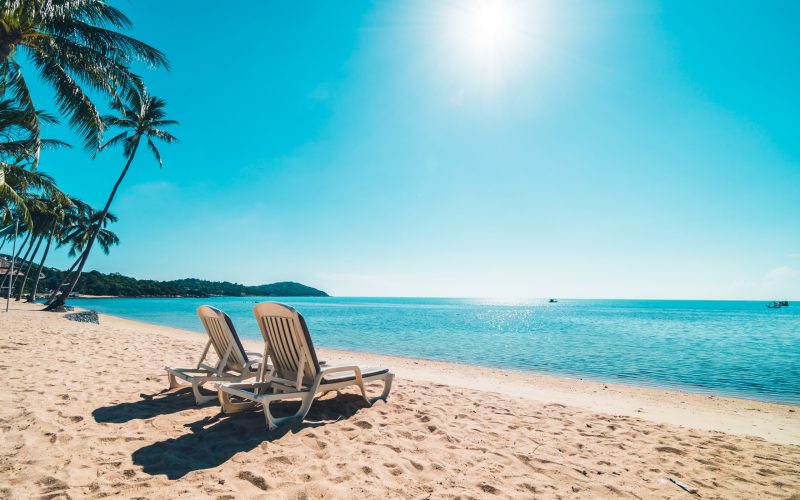 Beautiful tropical beach and sea with chair on blue sky for travel and vacation