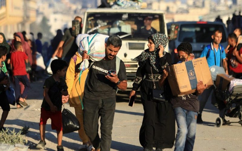 Palestinians, who fled the eastern part of Gaza City after they were ordered by Israeli army to evacuate their neighborhoods, carry their belongings, amid Israel-Hamas conflict, in Gaza City, July 7, 2024. REUTERS/Dawoud Abu Alkas