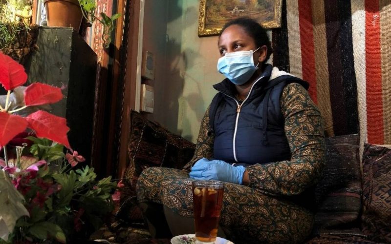 x87593471_FILE-PHOTO-A-woman-wears-a-mask-and-gloves-as-a-measure-to-combat-the-spread-of-coronav.jpg.pagespeed.ic.zfQhhfGqvy